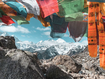 Prayer flags against snowcapped mountains