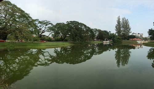 Reflection of trees in lake against sky