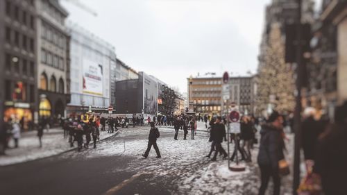 People walking on street in city