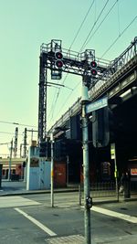 Low angle view of power lines against sky