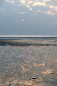 Scenic view of sea against sky at sunset