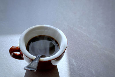 High angle view of coffee cup on table