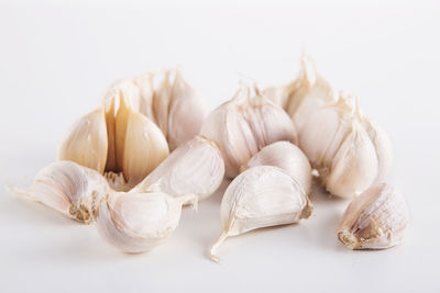 Close-up of garlic against white background