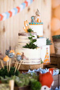 Christmas decoration and cakes on table