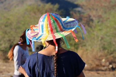 Rear view of woman wearing colorful hat