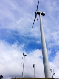 Low angle view of windmill against sky