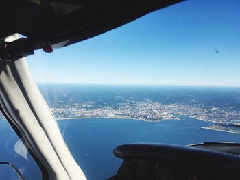 Scenic view of landscape against sky seen from airplane cockpit