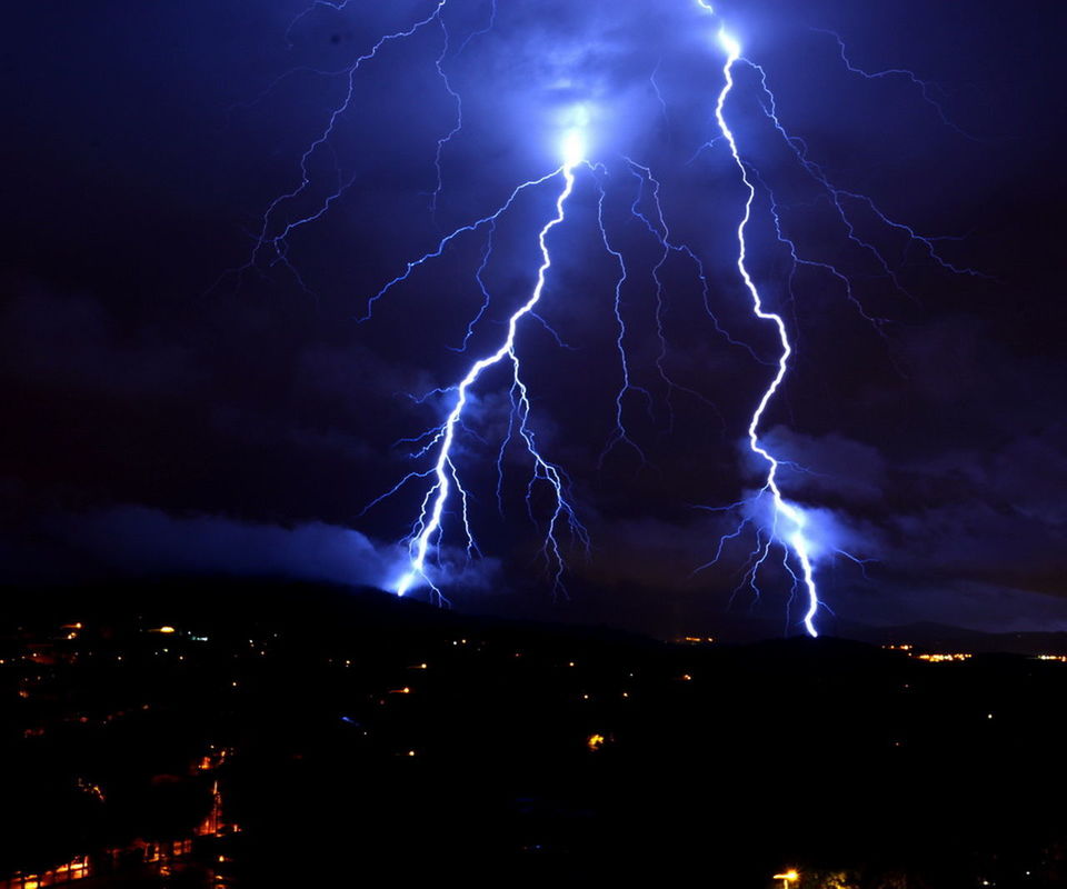 night, sky, illuminated, thunderstorm, lightning, power in nature, long exposure, low angle view, storm, glowing, storm cloud, forked lightning, cloud - sky, dramatic sky, scenics, beauty in nature, nature, atmospheric mood, light - natural phenomenon, motion