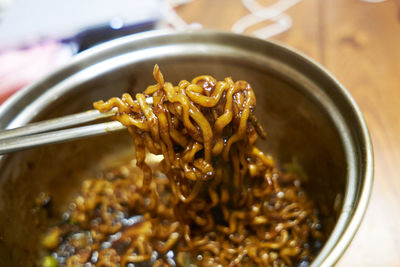 Close-up of noodles served on table