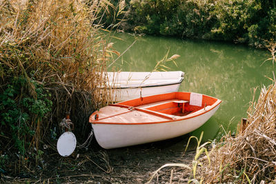 Boat moored at lakeshore