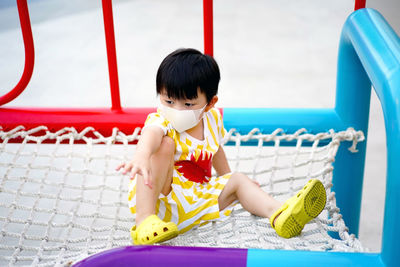 Close-up of cute boy looking away