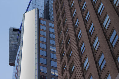 Low angle view of modern buildings against clear sky