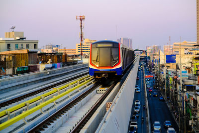 High angle view of train in city against sky