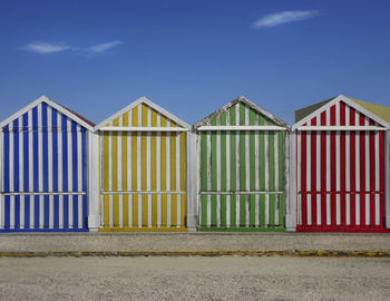 Beach huts against sky