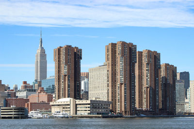 Modern buildings in city against sky