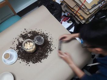 High angle view of person preparing food on table