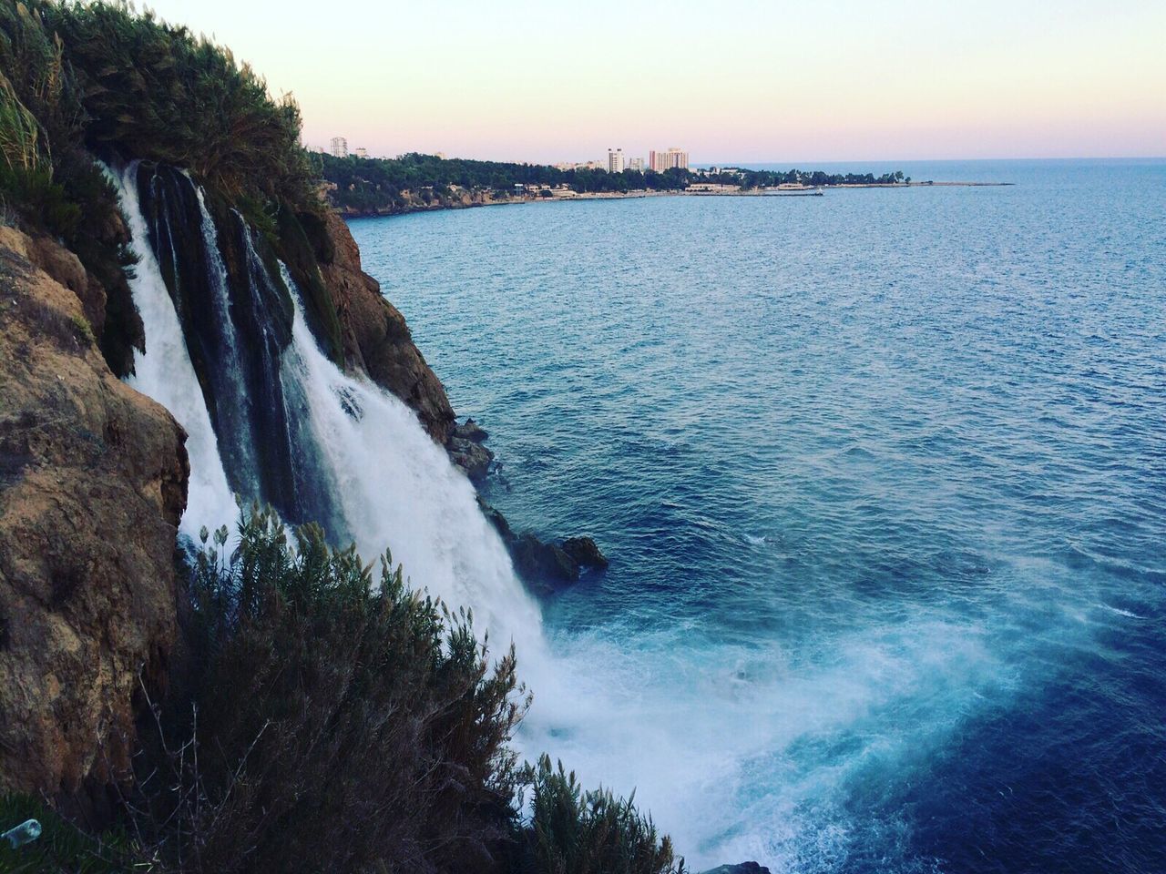 water, sea, scenics, beauty in nature, tranquil scene, nature, tranquility, wave, surf, rock - object, horizon over water, motion, rock formation, tree, sky, idyllic, clear sky, coastline, rippled, no people