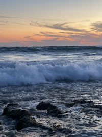 Scenic view of sea against sky during sunset