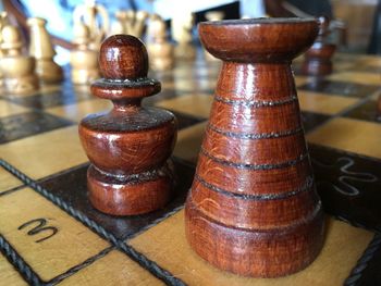 Close-up of chess pieces on table