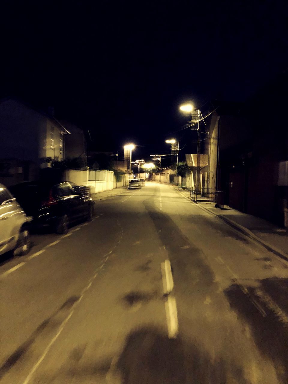 ILLUMINATED STREET AT NIGHT