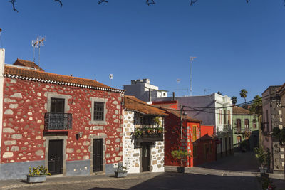 Low angle view of buildings against blue sky