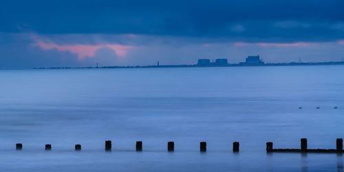 Scenic view of sea against sky during sunrise