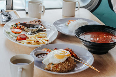 High angle view of breakfast served on table