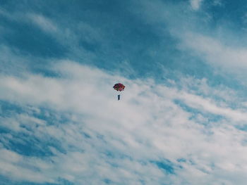 Low angle view of kite flying in sky