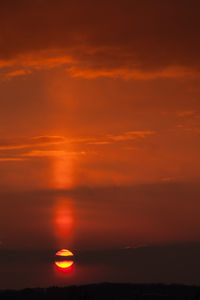 Scenic view of sea against romantic sky at sunset