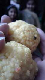 Close-up of hand holding ice cream