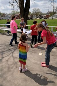 Girl with umbrella standing on the ground