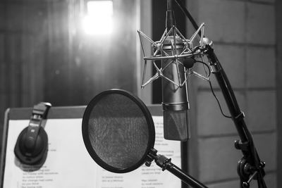 Close-up of microphone with soundproof in recording studio