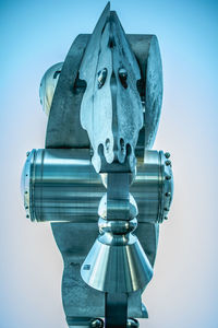 Low angle view of statue against clear blue sky