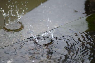 High angle view of water splashing on beach