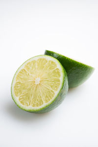 Close-up of lemon against white background
