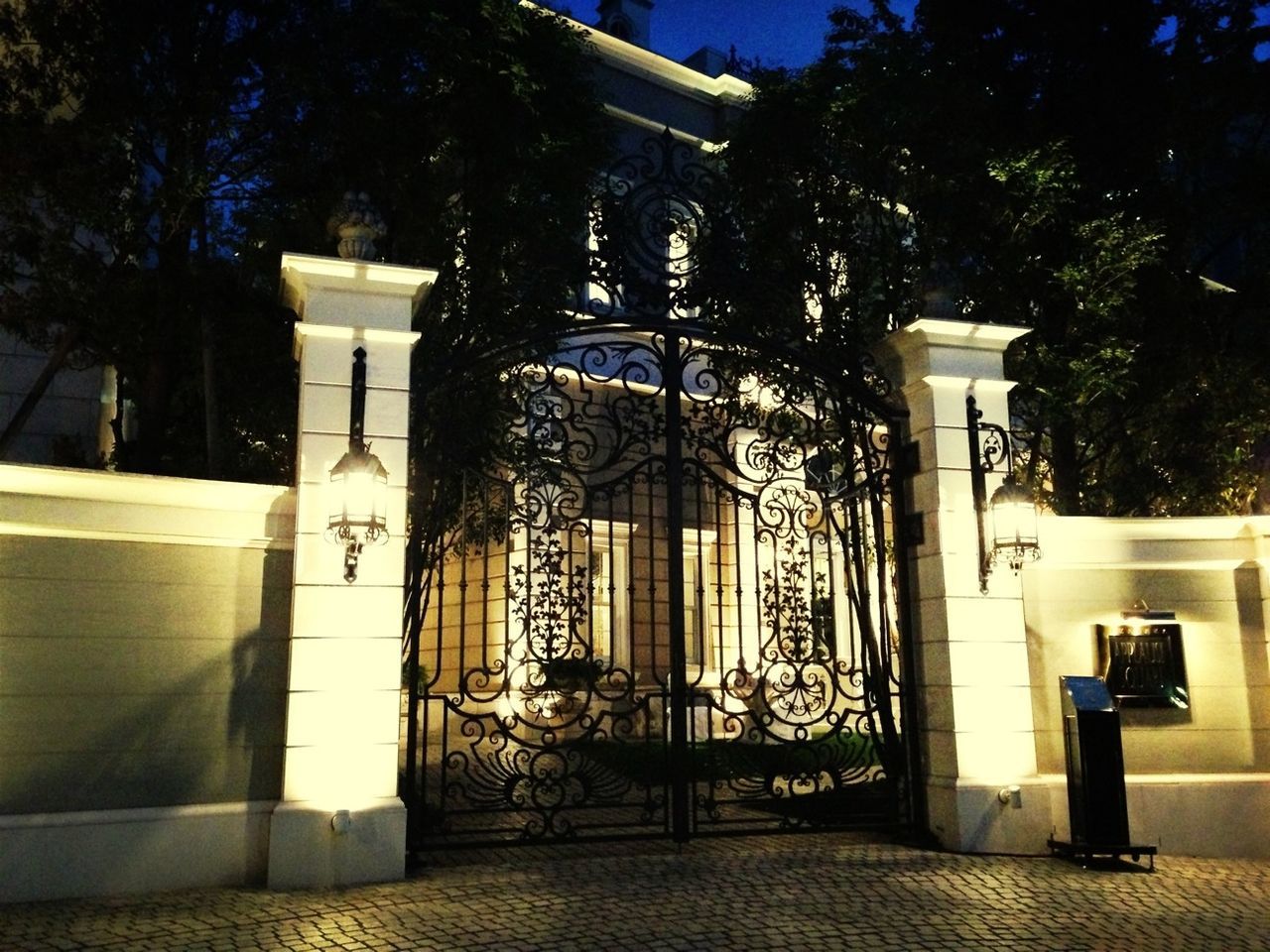 architecture, built structure, building exterior, tree, house, door, sunlight, window, entrance, railing, no people, closed, day, absence, outdoors, residential structure, gate, residential building, empty, potted plant