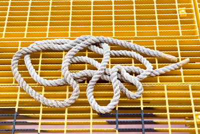 Close-up of rope tied on metal