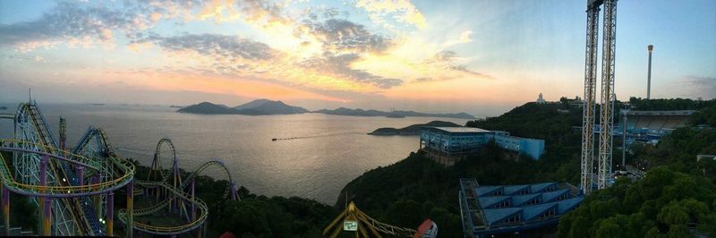 View of harbor against cloudy sky at sunset