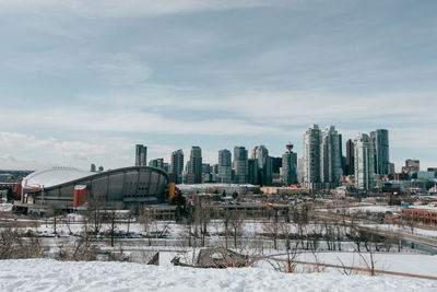 Buildings in city against sky