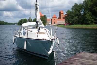 Boat sailing on sea against sky