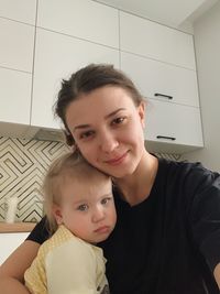 High angle view of mother and daughter at home