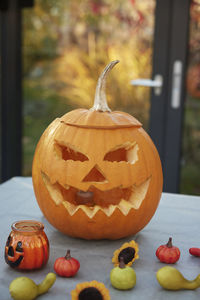 Carved jack-o-lantern on table