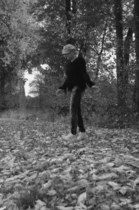 Full length of woman walking on tree