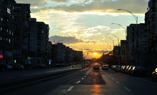 View of city street at sunset