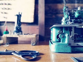 Close-up of tool and scissors on table