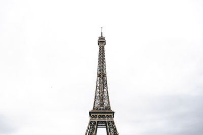 Low angle view of communications tower against sky