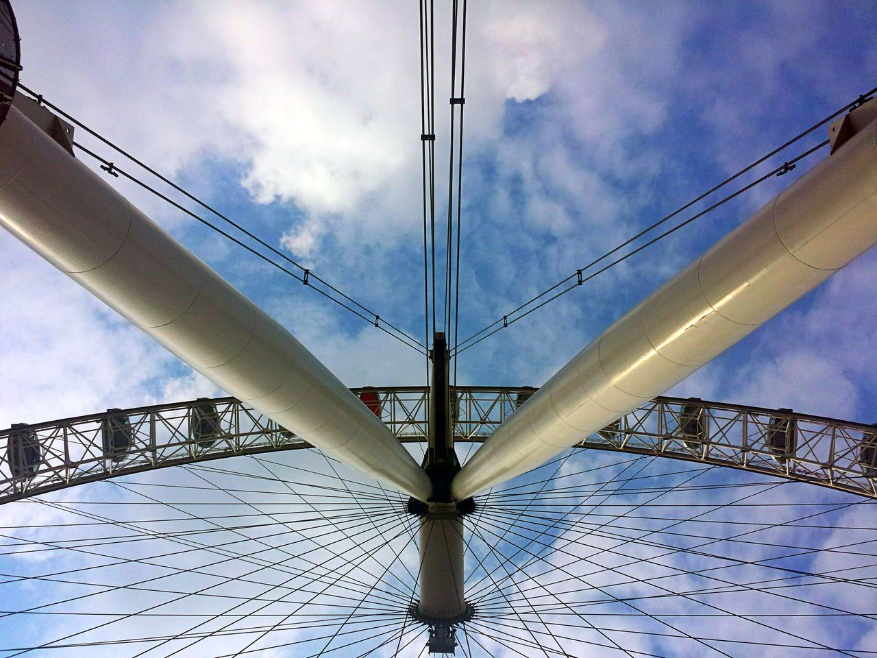 low angle view, connection, sky, engineering, built structure, architecture, bridge - man made structure, cloud - sky, suspension bridge, steel cable, transportation, cloud, cloudy, metal, cable-stayed bridge, cable, bridge, day, famous place, outdoors