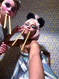 Portrait of happy woman holding umbrella