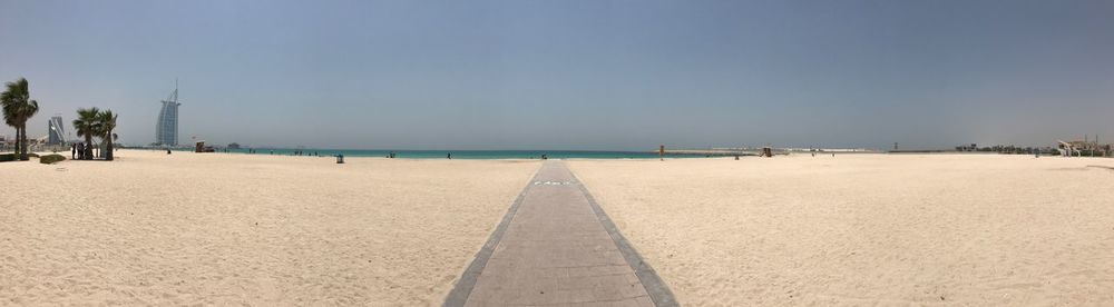 Scenic view of beach against clear sky