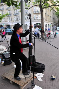 Full length of woman standing in city